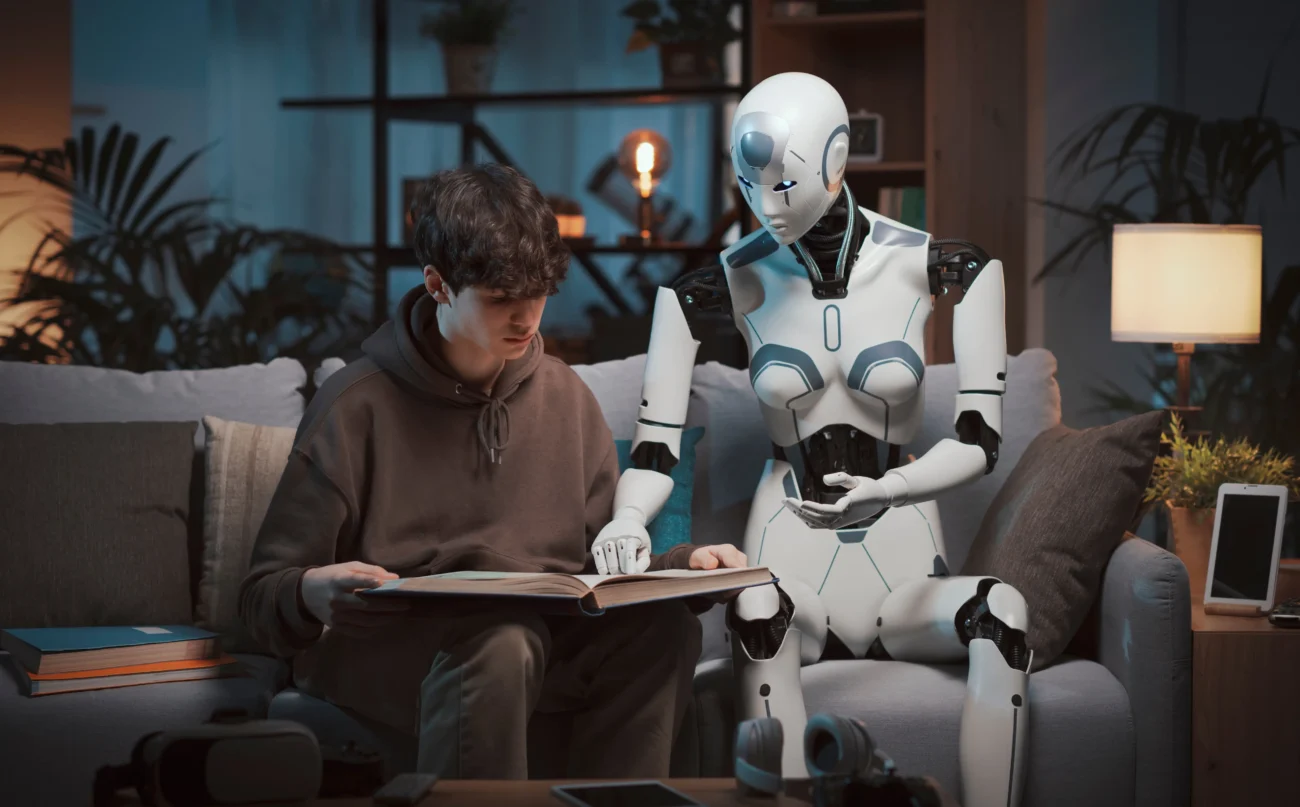 shutterstock_2274310837-2 | TVGURU.cz Robot s chlapcem sedí na gauči.