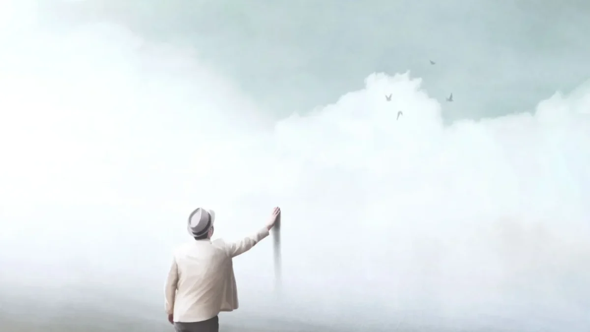 muž sahající na malbu umělého nebe