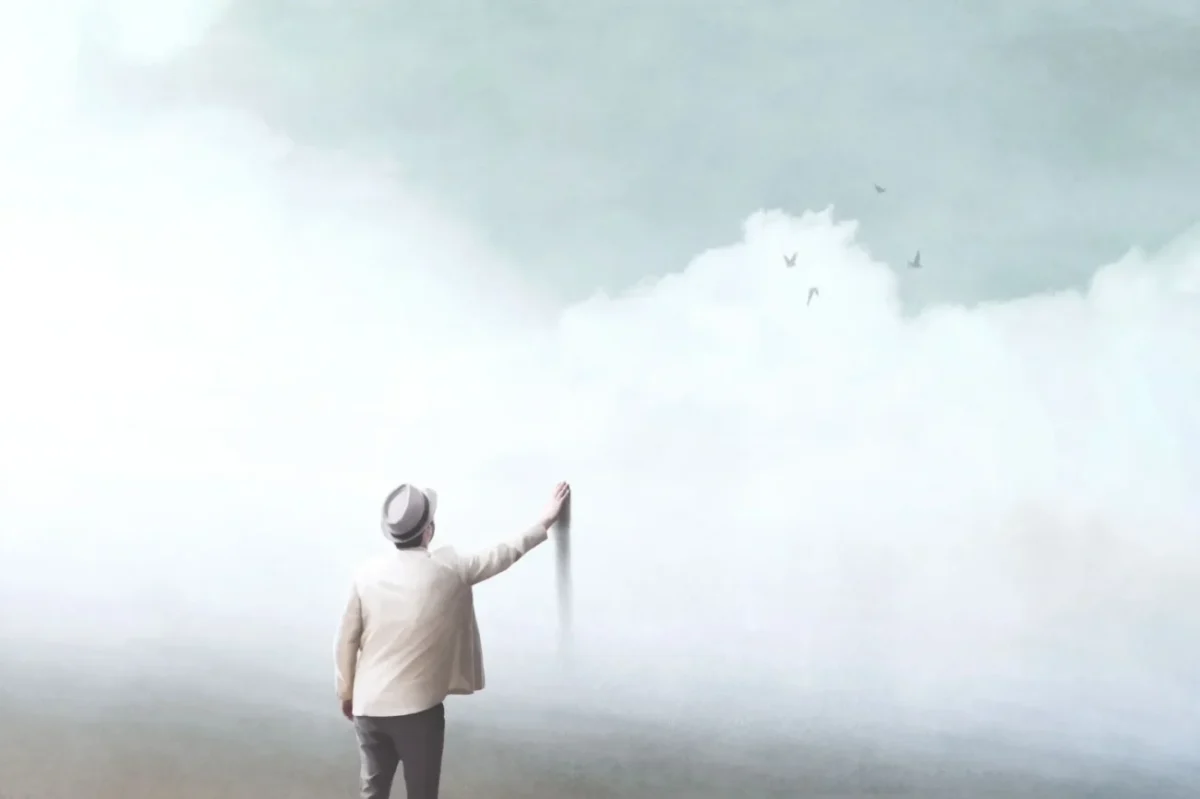 muž sahající na malbu umělého nebe