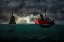 Žena se plaví v deštníku po vodě.