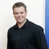 Matt Damon se usmívá.