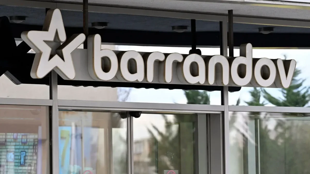Storefront sign showing the word 'barandov' with a large star logo on the left, mounted above glass doors.