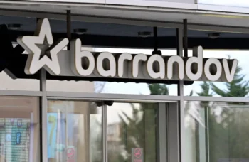Storefront sign showing the word 'barandov' with a large star logo on the left, mounted above glass doors.
