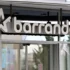 Storefront sign showing the word 'barandov' with a large star logo on the left, mounted above glass doors.