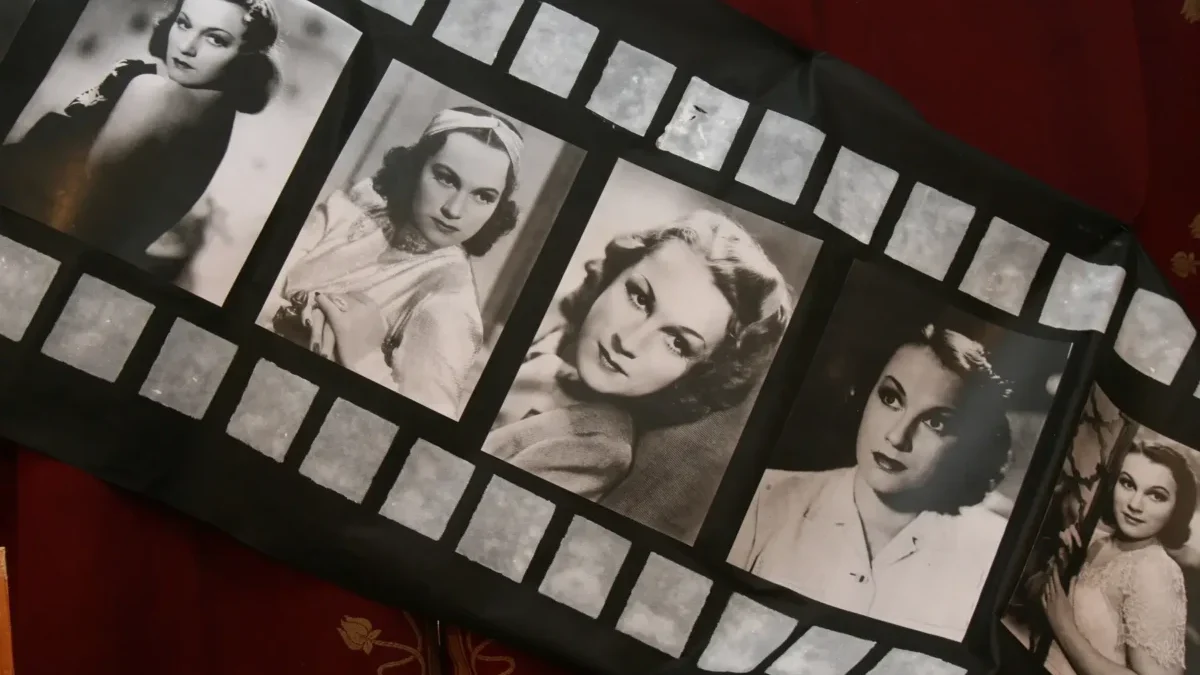 Fabric item featuring a film-strip design with black-and-white vintage Hollywood portraits of women.