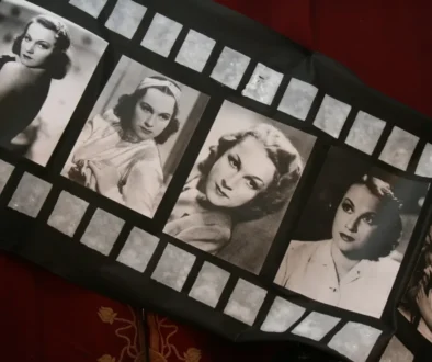 Fabric item featuring a film-strip design with black-and-white vintage Hollywood portraits of women.