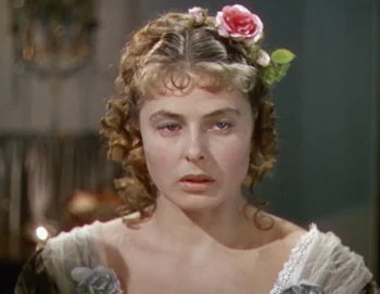 Žena s květinou ve vlasech