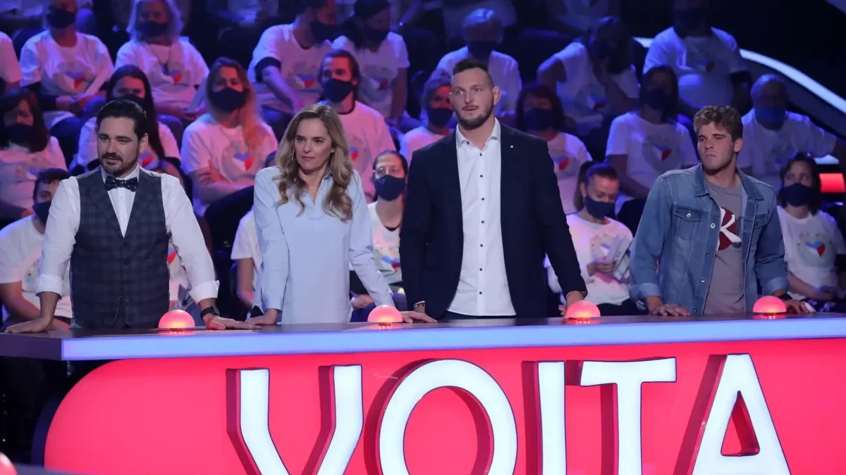 muži a ženy za pultem s nápisem Vojta