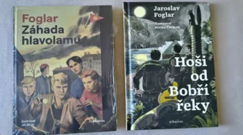 Two vintage Czech adventure paperbacks laid on a surface; left cover shows a group of boys under a cloudy sky with the title Foglar Záhada hlavolamu, right cover titled Hoši od Bobří řeky with a moonlit jungle scene.