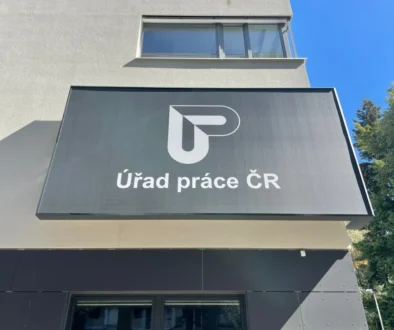 Exterior sign of the Czech Labour Office (Úřad práce ČR) on a modern building façade.